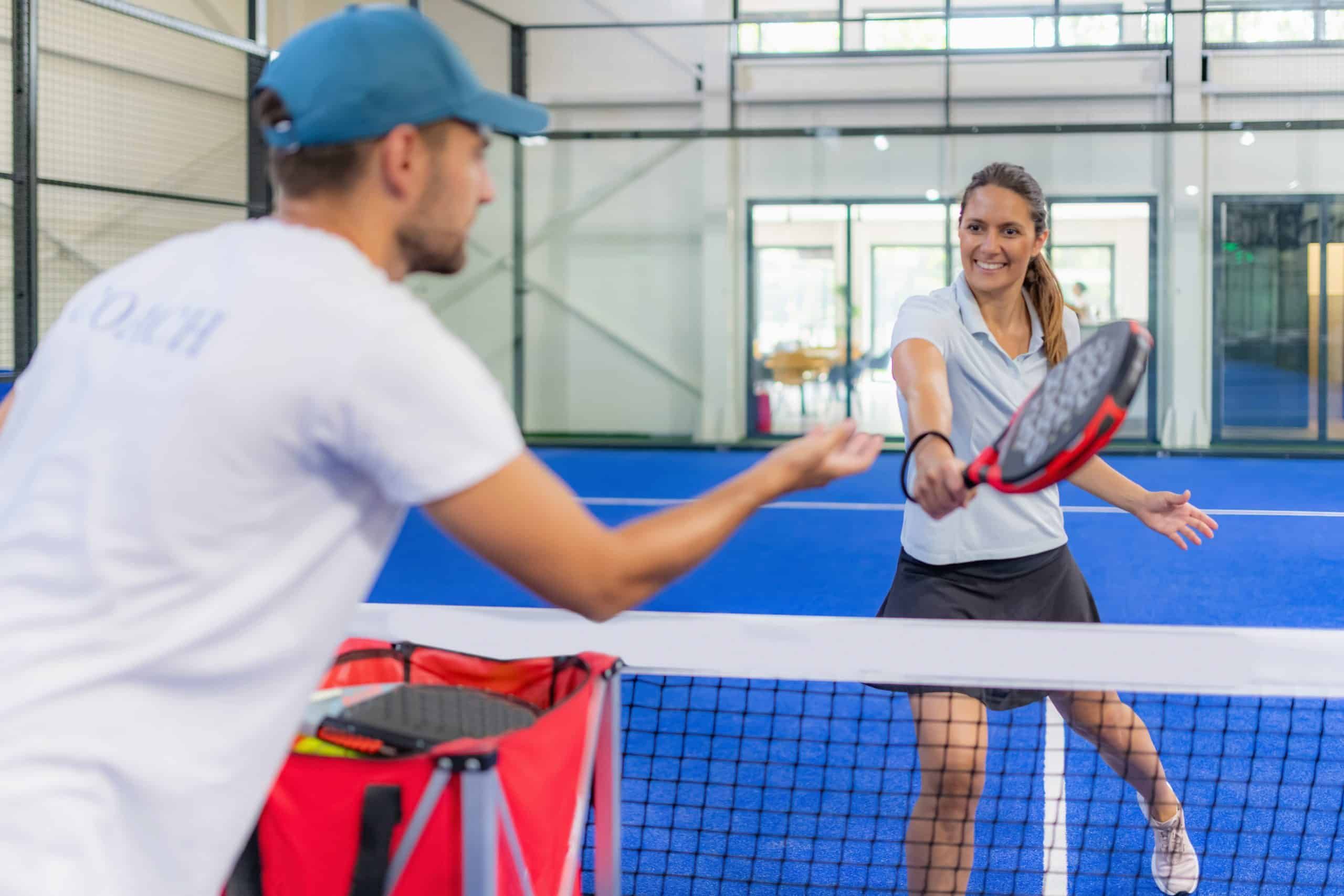 skillful player on indoor padel training